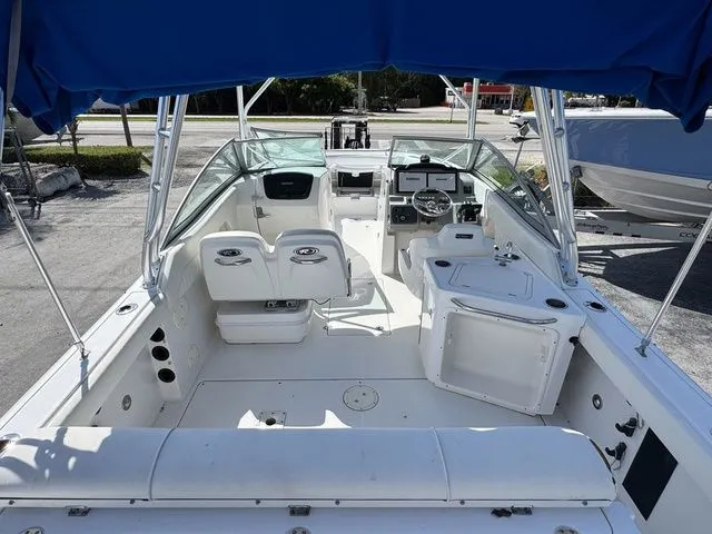 Slide: The Image of Interior view of a 2012 Robalo 247 DC boat with blue canopy. - 6