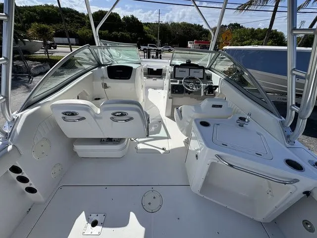 Slide: The Image of Interior view of a 2012 Robalo 247 DC boat with helm console. - 8