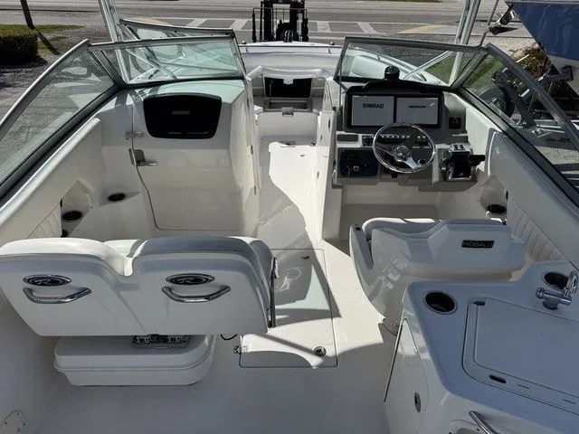 Slide: The Image of Interior view of a 2012 Robalo 247 DC boat with helm console. - 9