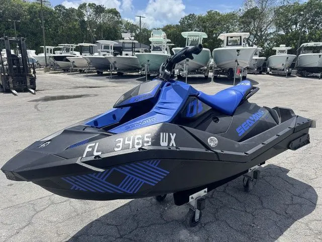 Slide: The Image of 2023 Sea-Doo Spark Trixx 2-up jet ski on parking lot. - 5
