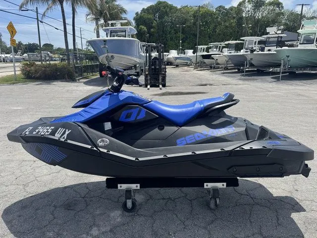 Slide: The Image of 2023 Sea-Doo Spark Trixx 2-up jet ski on parking lot. - 6