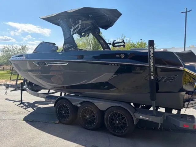 Slide: The Image of 2024 Tigé 23ZX boat on trailer in daylight. - 3