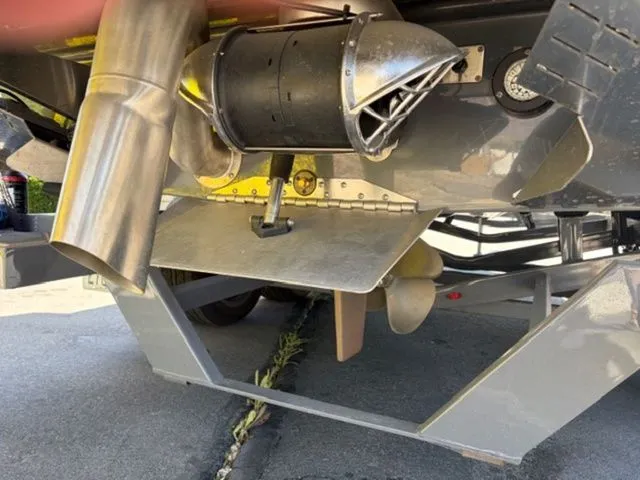 Slide: The Image of Underside of 2024 Tigé 23ZX boat showing propeller and exhaust. - 9