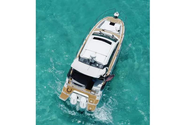 Slide: The Image of Aerial view of 2024 Beneteau Gran Turismo 36 yacht on turquoise water. - 8