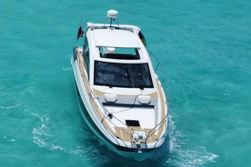 Slide: The Image of 2024 Beneteau Gran Turismo 36 cruising on clear turquoise waters. - 5