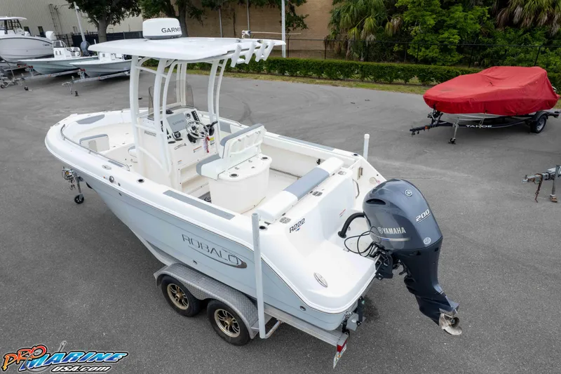 Slide: The Image of 2021 Robalo R222 Center Console boat with Yamaha engine on trailer. - 11