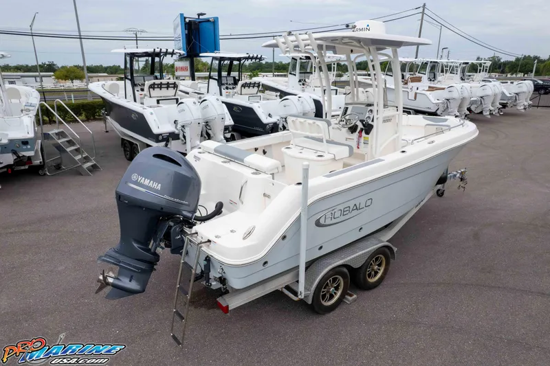 Slide: The Image of 2021 Robalo R222 Center Console boat with Yamaha engine on trailer in dealership lot. - 15