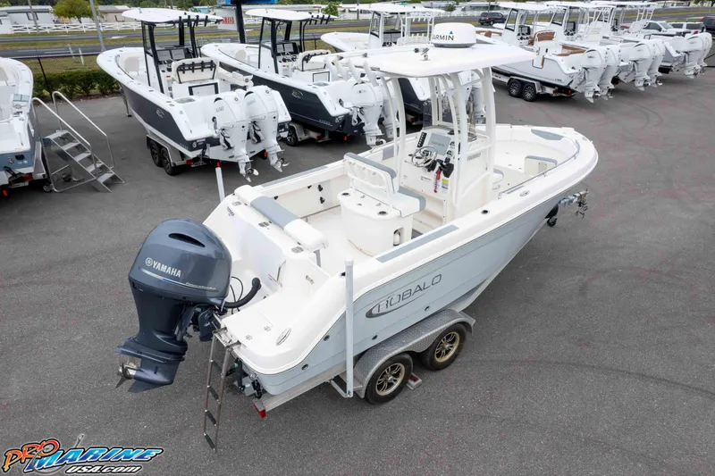 Slide: The Image of 2021 Robalo R222 Center Console boat with Yamaha engine, displayed in a dealership lot. - 16