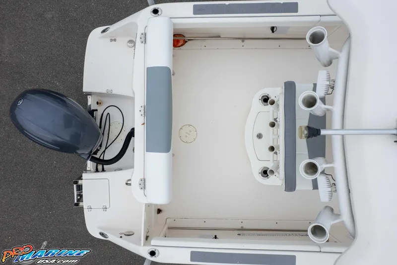 Slide: The Image of Overhead view of 2021 Robalo R222 Center Console boat's deck and engine. - 21