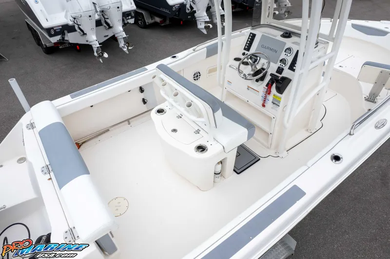 Slide: The Image of 2021 Robalo R222 Center Console boat interior with steering console and seating. - 22