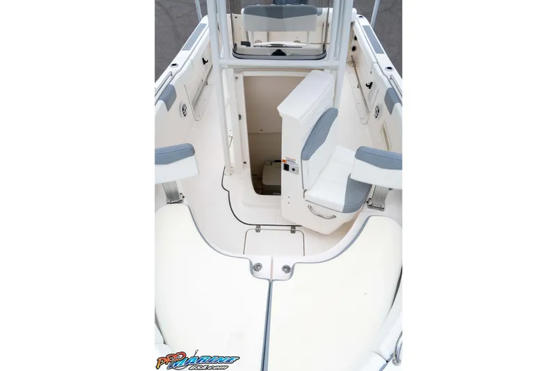 Slide: The Image of 2021 Robalo R222 Center Console boat interior with seating and storage area. - 23