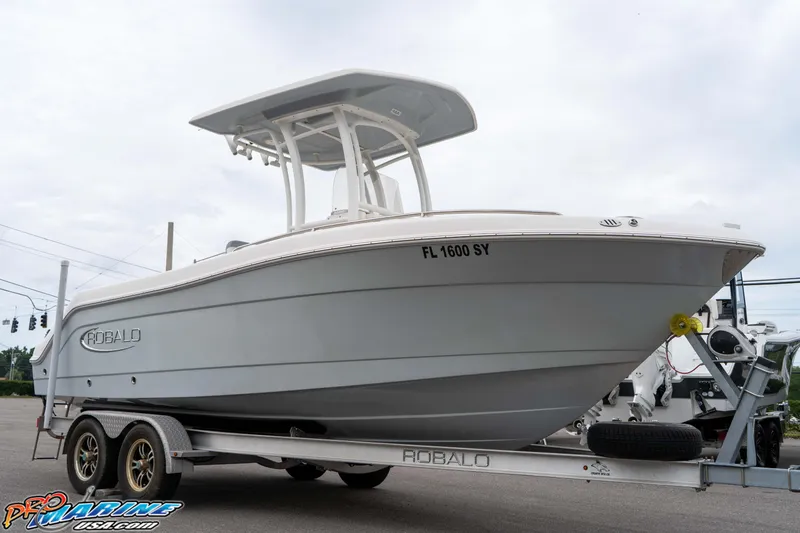 Slide: The Image of 2021 Robalo R222 Center Console boat on trailer, side view. - 26