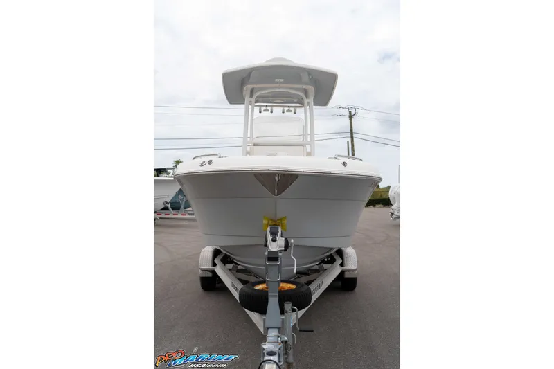Slide: The Image of 2021 Robalo R222 Center Console boat on trailer, front view. - 29
