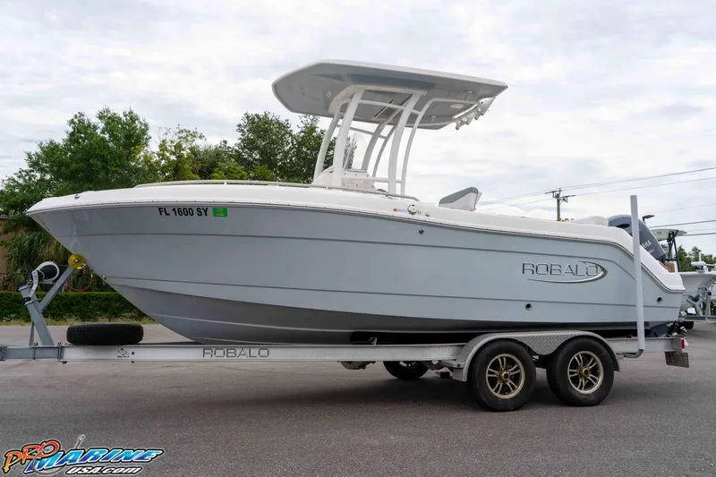 Slide: The Image of 2021 Robalo R222 Center Console boat on trailer, side view. - 31