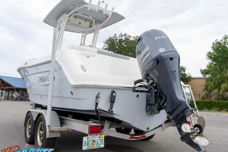 Slide: The Image of 2021 Robalo R222 Center Console boat on trailer with Yamaha outboard motor. - 33