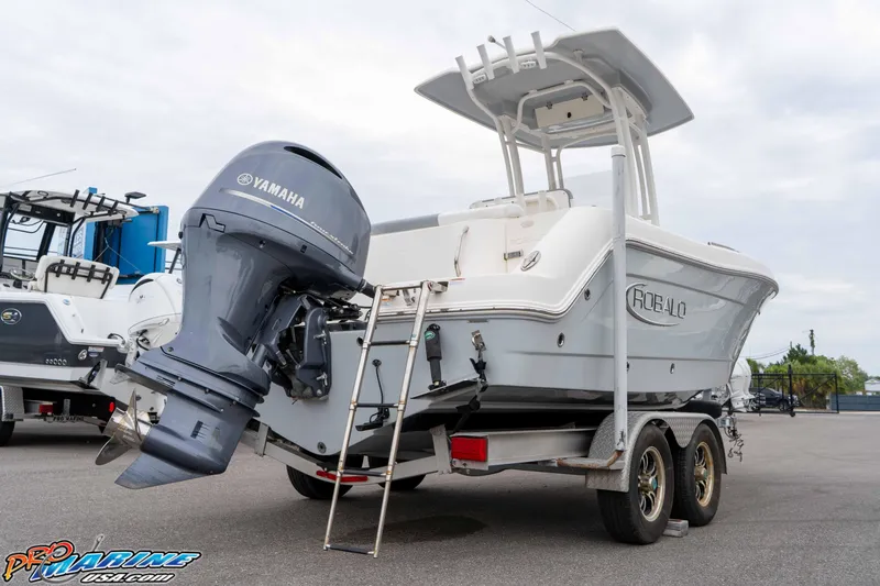 Slide: The Image of 2021 Robalo R222 Center Console boat with Yamaha engine on trailer. - 35