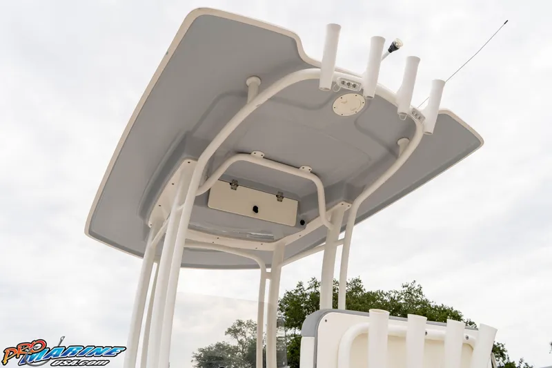 Slide: The Image of 2021 Robalo R222 Center Console T-top with rod holders and antenna. - 40