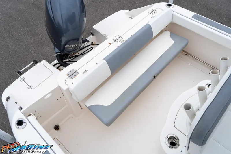 Slide: The Image of 2021 Robalo R222 Center Console boat interior with seating and motor. - 42