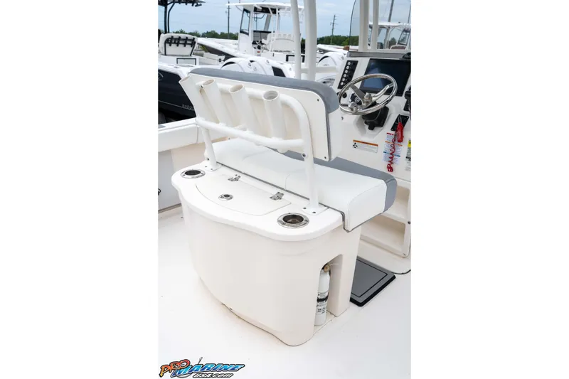 Slide: The Image of 2021 Robalo R222 Center Console boat interior with helm and seating area. - 43