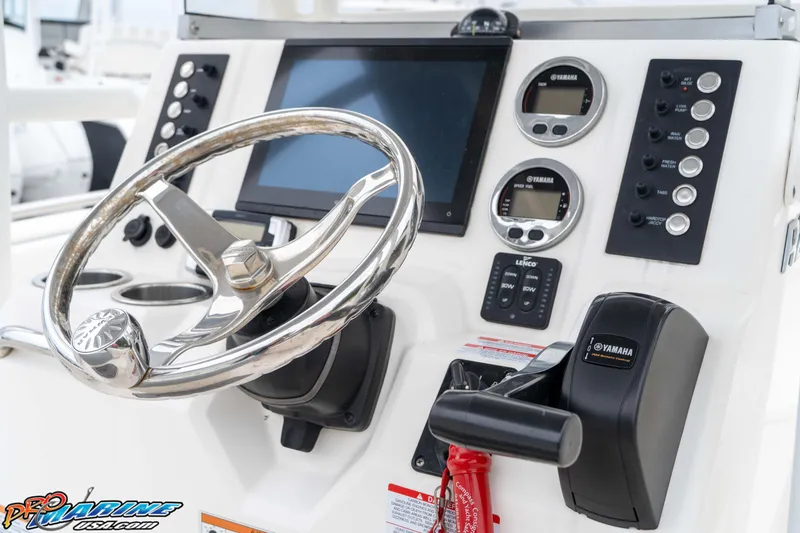 Slide: The Image of 2021 Robalo R222 Center Console dashboard with steering wheel and Yamaha controls. - 45