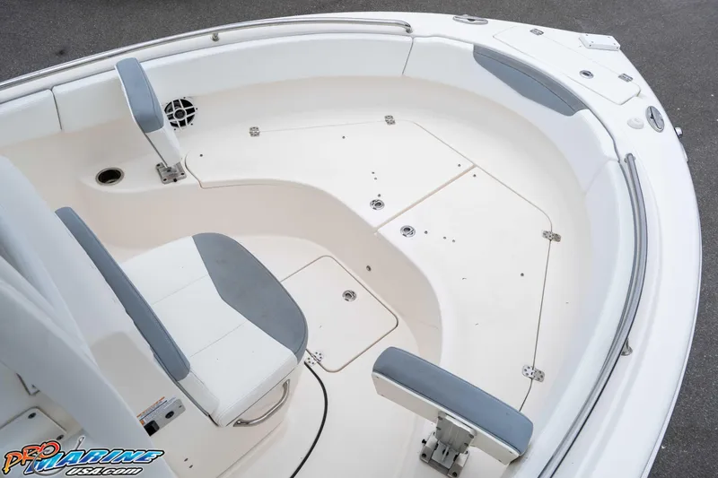 Slide: The Image of 2021 Robalo R222 Center Console boat interior with seating and storage compartments. - 46