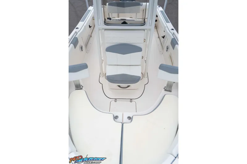 Slide: The Image of 2021 Robalo R222 Center Console boat interior with seating and storage compartments. - 49