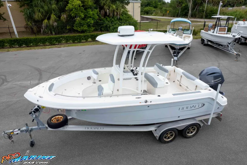 The Image of 2021 Robalo R222 Center Console boat on trailer, parked outdoors. - 8