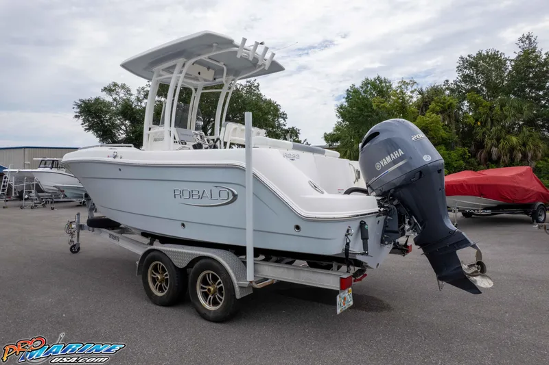 Slide: The Image of 2021 Robalo R222 Center Console boat on trailer with Yamaha outboard motor. - 9