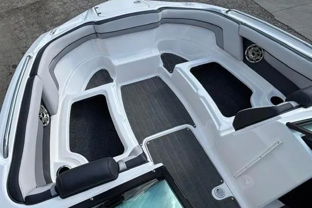 Slide: The Image of 2016 Yamaha Boats 212X interior, featuring spacious seating and sleek design. - 10
