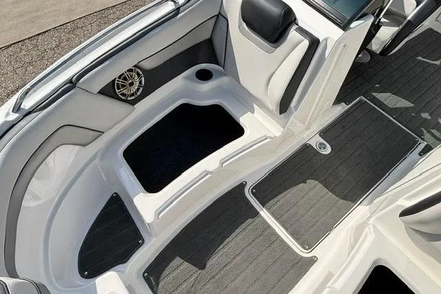 Slide: The Image of Interior view of a 2016 Yamaha Boats 212X, featuring seating and speaker details. - 11