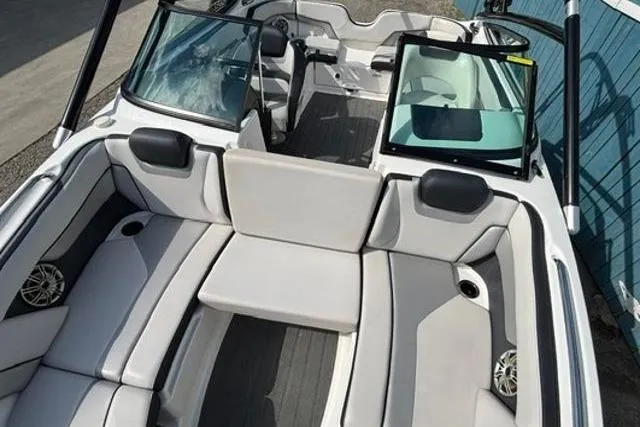 Slide: The Image of 2016 Yamaha Boats 212X interior with spacious seating and modern design. - 13