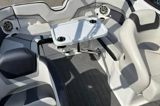 Slide: The Image of Interior of 2016 Yamaha Boats 212X with seating and table setup. - 15