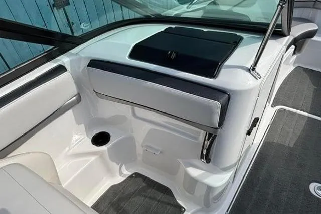 Slide: The Image of Interior view of a 2016 Yamaha Boats 212X, featuring sleek seating and modern design. - 18