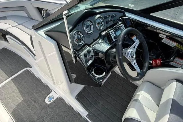 Slide: The Image of Interior view of 2016 Yamaha Boats 212X dashboard and steering wheel. - 21