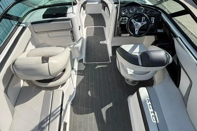 Slide: The Image of 2016 Yamaha Boats 212X interior with sleek seating and modern dashboard design. - 24