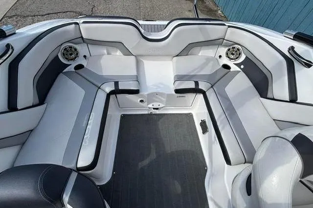 Slide: The Image of 2016 Yamaha Boats 212X interior with sleek seating and integrated speakers. - 27