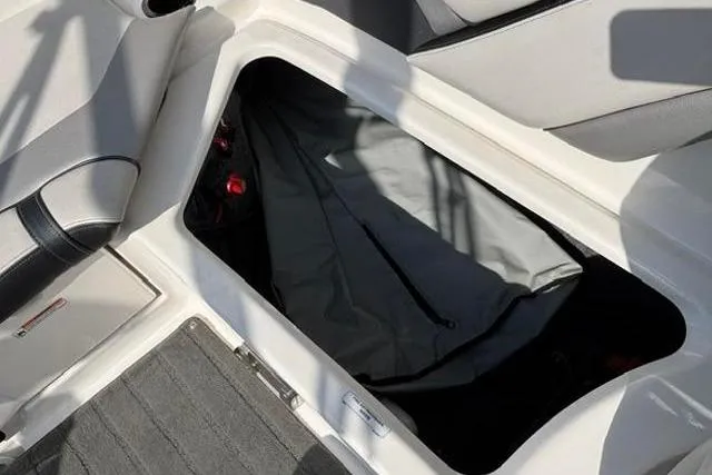 Slide: The Image of Storage compartment in a 2016 Yamaha Boats 212X, featuring spacious interior design. - 29
