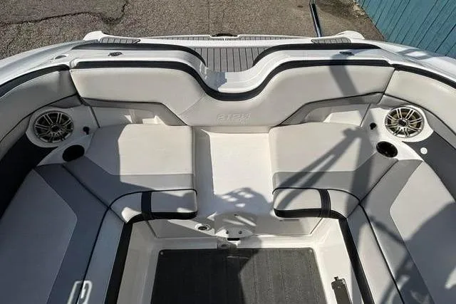 Slide: The Image of Interior seating of 2016 Yamaha Boats 212X, featuring gray and white upholstery. - 30