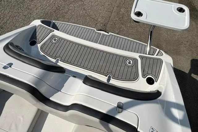 Slide: The Image of 2016 Yamaha Boats 212X swim platform with table, featuring sleek design and non-slip surface. - 32