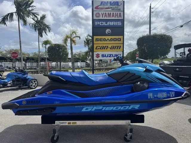 The Image of 2023 Yamaha WaveRunner GP1800R in blue on a parking lot. - 1