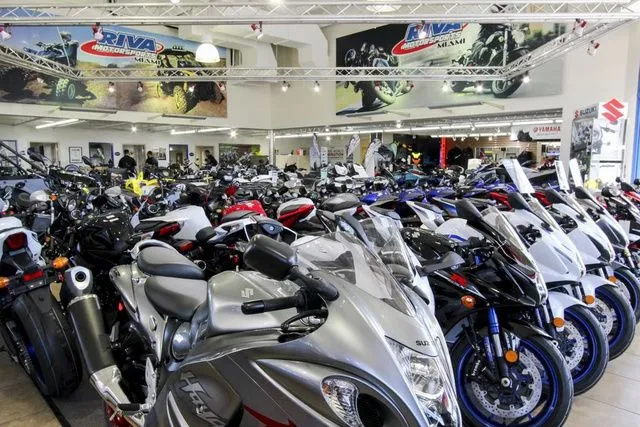 Slide: The Image of Motorcycle showroom featuring Yamaha WaveRunner GP1800R 2023 model. - 24