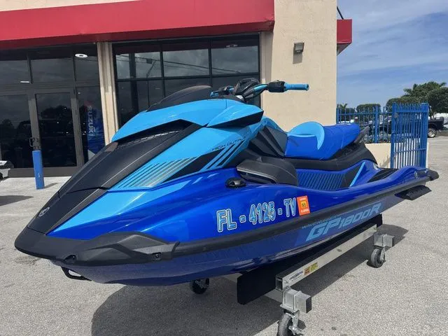 Slide: The Image of 2023 Yamaha WaveRunner GP1800R in blue outside a building. - 4