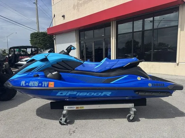 Slide: The Image of 2023 Yamaha WaveRunner GP1800R in blue outside a building. - 5
