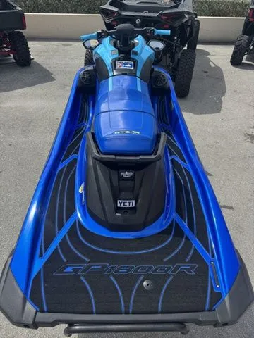 Slide: The Image of 2023 Yamaha WaveRunner GP1800R in blue on parking lot. - 7
