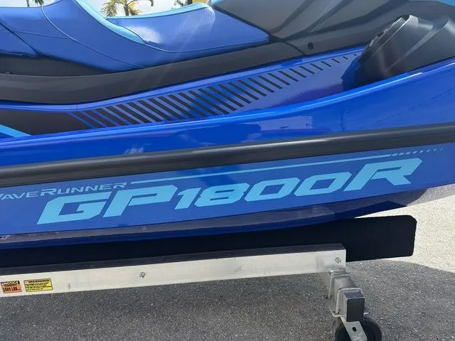 Slide: The Image of 2023 Yamaha WaveRunner GP1800R in blue on trailer. - 9