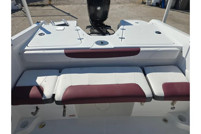 Slide: The Image of 2020 Tahoe 500 TF boat interior with white and maroon seating, rear view. - 13