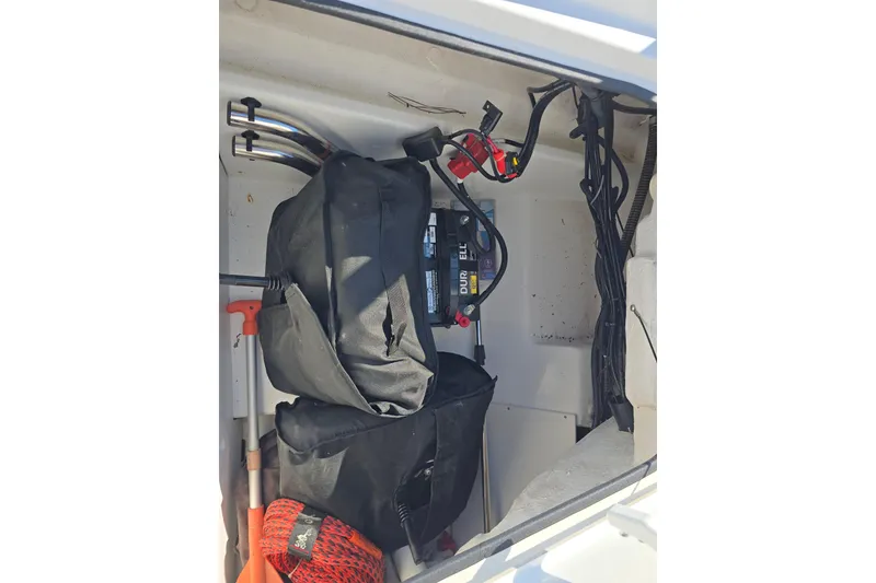Slide: The Image of Storage compartment of 2020 Tahoe 500 TF boat with battery and equipment. - 14
