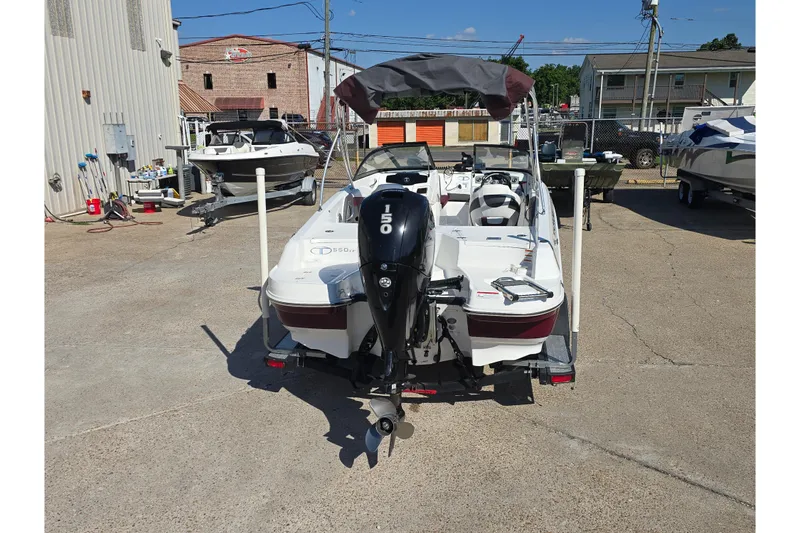 Slide: The Image of 2020 Tahoe 500 TF boat with 150 HP engine, parked outdoors on concrete. - 3