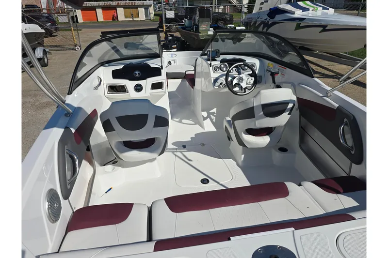 Slide: The Image of Interior of a 2020 Tahoe 500 TF boat, featuring modern seating and dashboard controls. - 9
