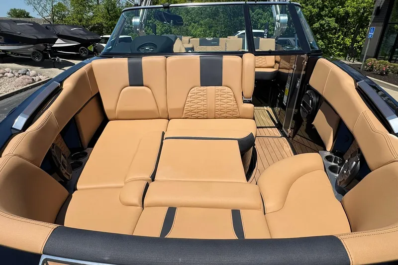 Slide: The Image of 2021 MasterCraft X26 boat interior with tan leather seating and modern design. - 6